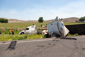 big rig accident on the side of the road