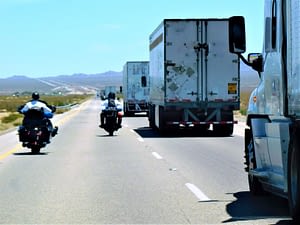 Motorcycles and trucks share the road. Protect yourself with a motorcycle accident lawyer.